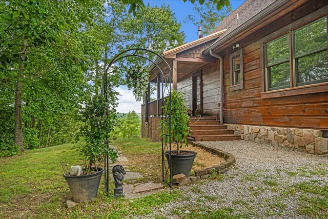 a view of a backyard with sitting area