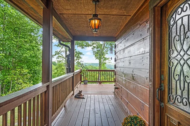 a view of a room with wooden floor and windows