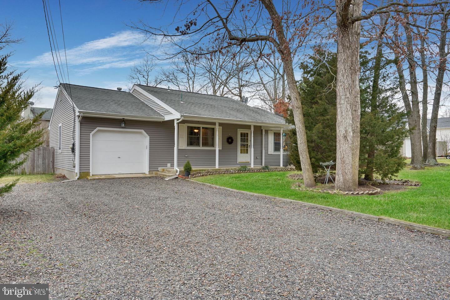 104 Ahoy Road Manahawkin, NJ 08050 - Photo 1 of 32 a view of a house with a yard and large tree