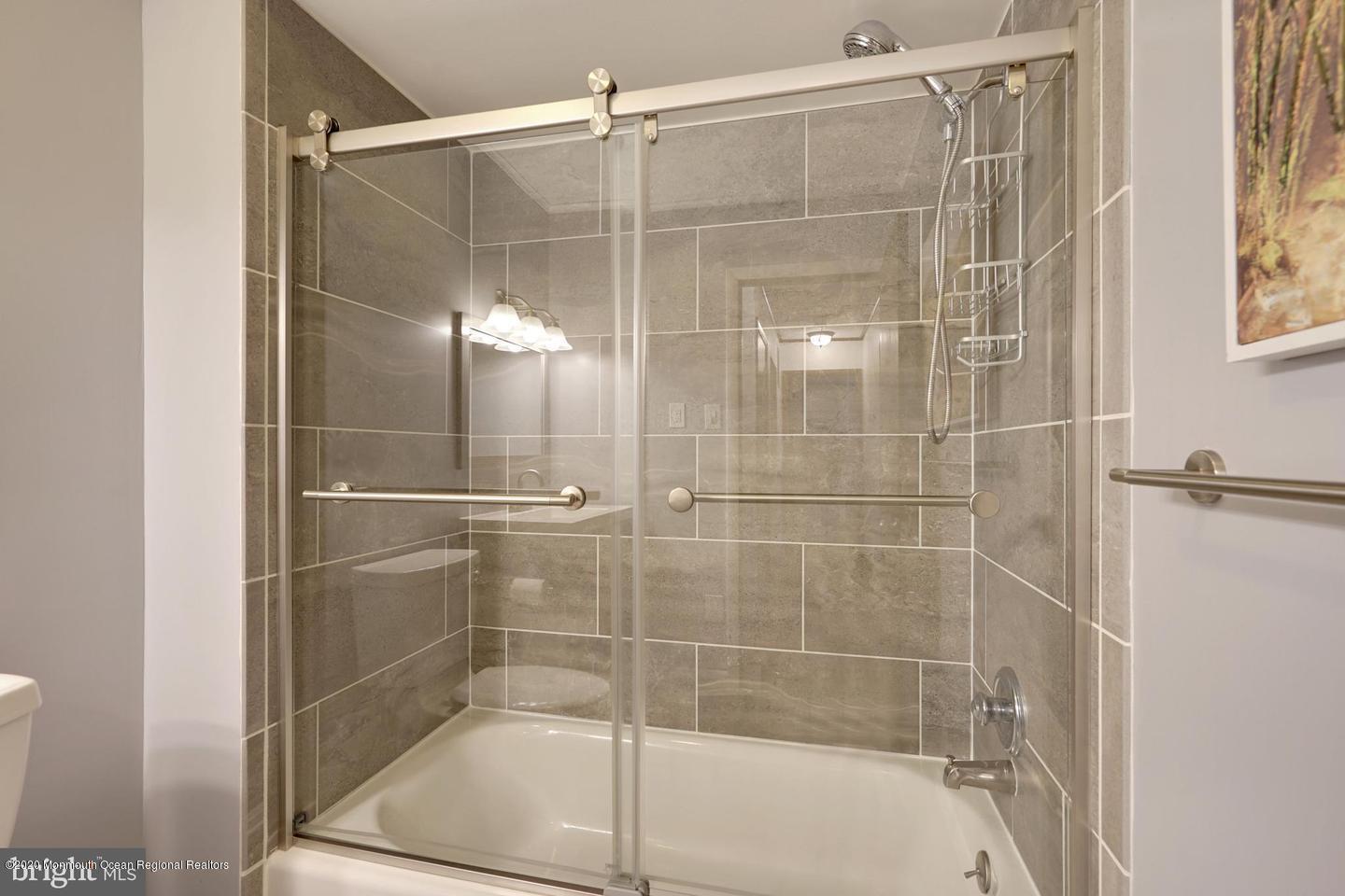 104 Ahoy Road Manahawkin, NJ 08050 - Photo 19 of 32 a bathroom with a shower