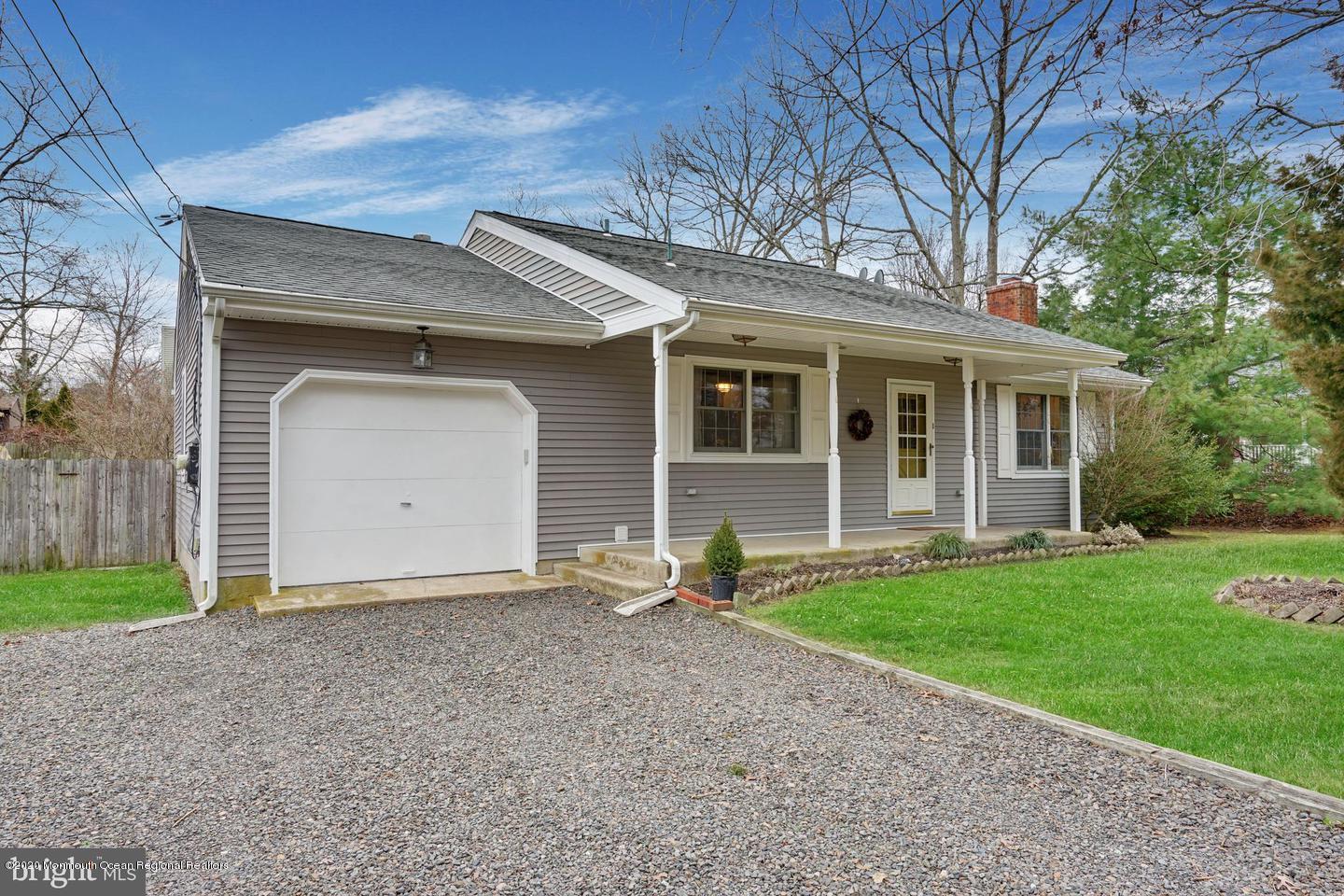 104 Ahoy Road Manahawkin, NJ 08050 - Photo 2 of 32 a backyard of a house with seating space and porch