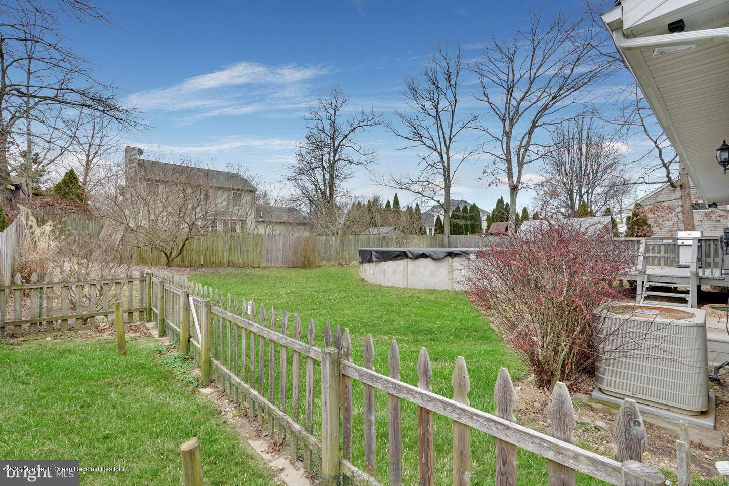 104 Ahoy Road Manahawkin, NJ 08050 - Photo 30 of 32 a view of a yard and large trees