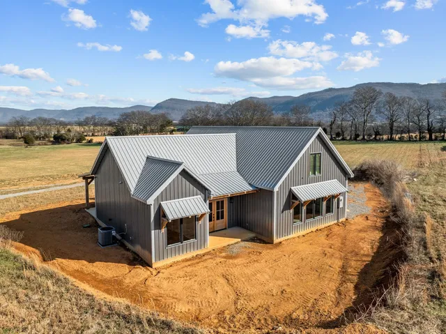 a aerial view of a house with a yard
