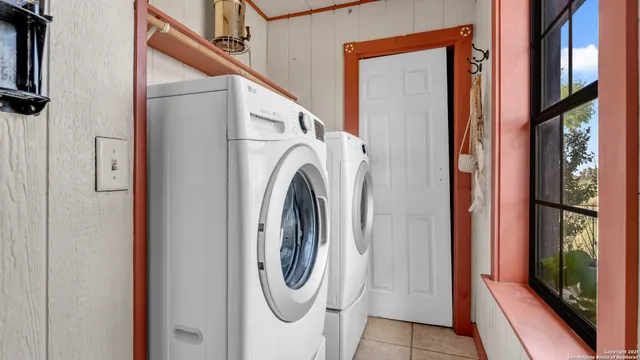 a utility room with dryer and washer