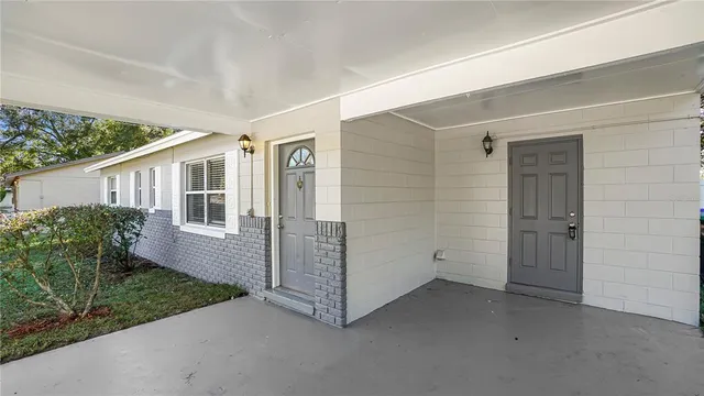 a view of house with backyard and garden