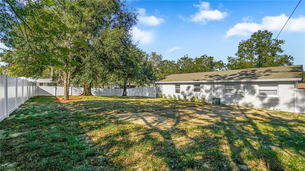 7906 Arabian Place Orlando, FL 32818 - Photo 23 of 23 a view of a house with a yard