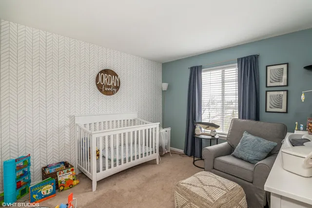 a bedroom with furniture and a window