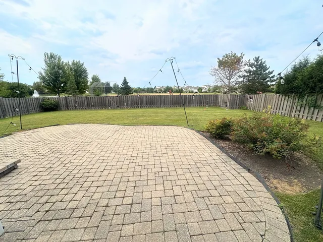 a view of swimming pool with a yard