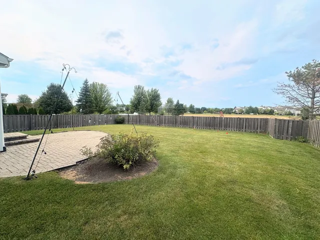a garden with wooden fence