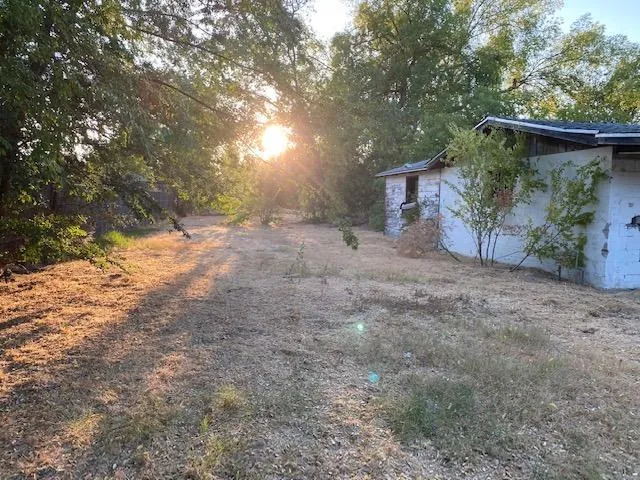 a view of a house with a tree