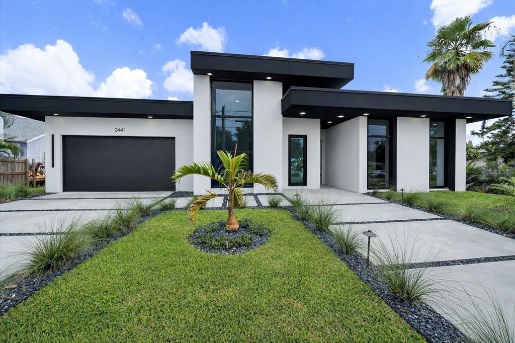 a front view of a house with garden