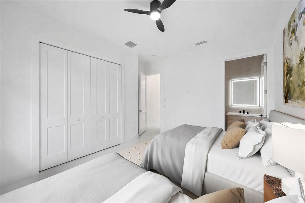 2441 Webber Street Sarasota, FL 34239 - Photo 13 of 19 a bedroom with a bed and a chandelier