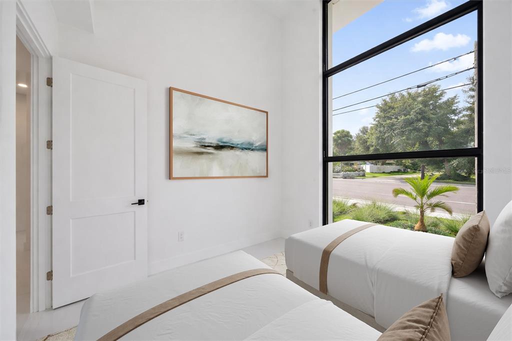 2441 Webber Street Sarasota, FL 34239 - Photo 17 of 19 a bedroom with a bed and a painting on the wall