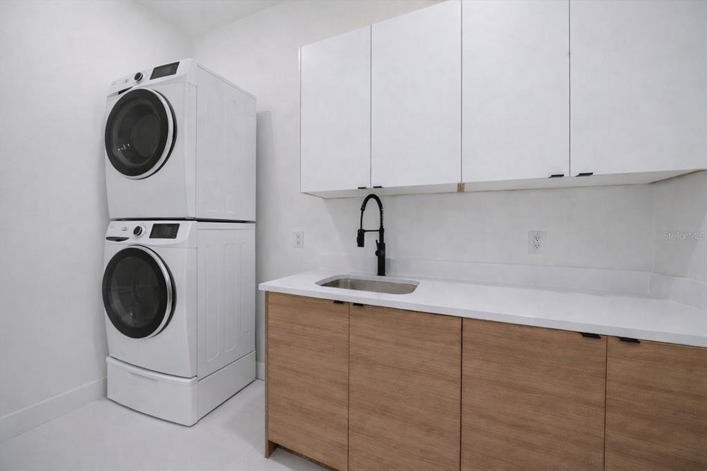 2441 Webber Street Sarasota, FL 34239 - Photo 19 of 19 a utility room with sink dryer and washer