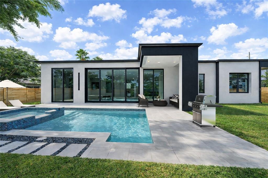 2441 Webber Street Sarasota, FL 34239 - Photo 2 of 19 a view of a house with backyard porch and garden
