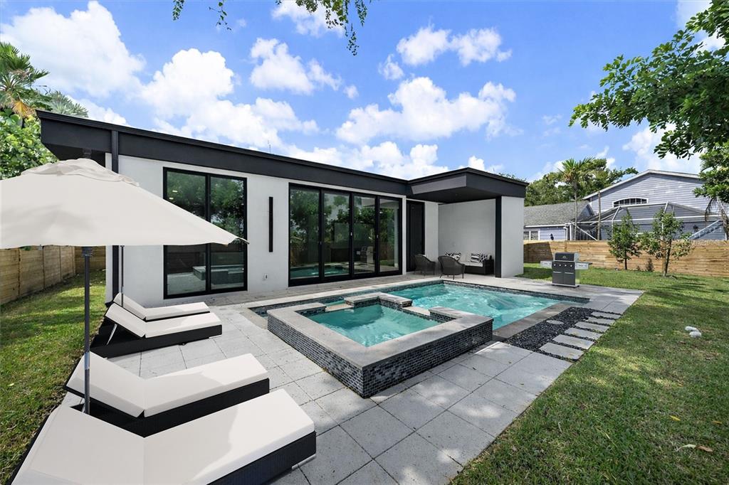 2441 Webber Street Sarasota, FL 34239 - Photo 3 of 19 a view of house with backyard and outdoor seating
