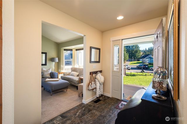 a living room with furniture and a garden