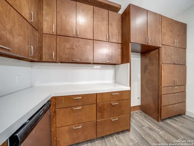 a kitchen with cabinets and appliances