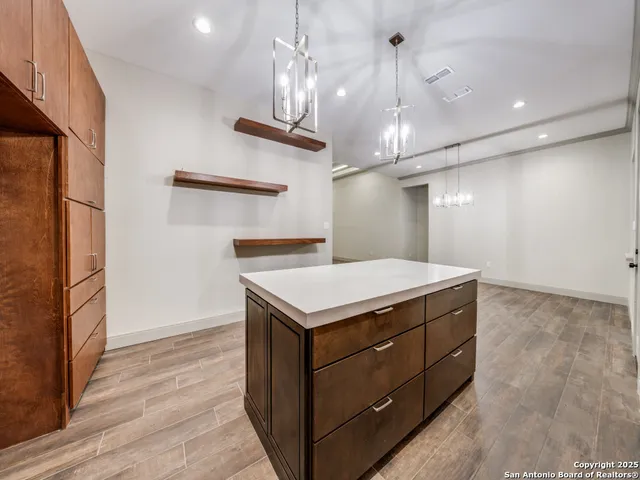 a kitchen that has a lot of cabinets
