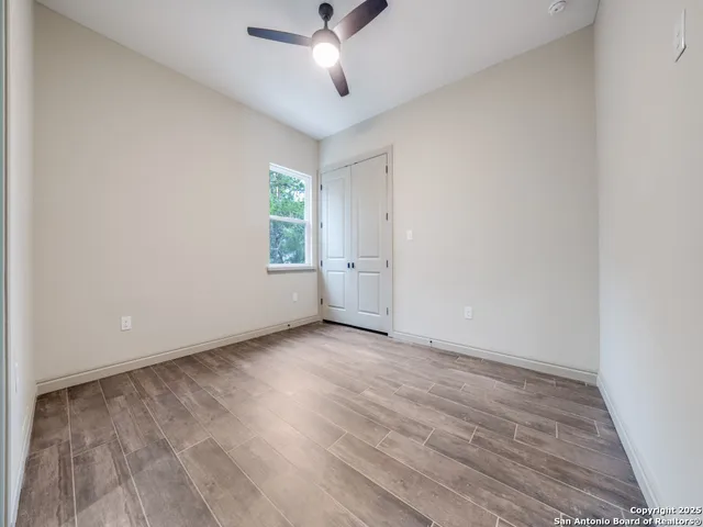 a bathroom with a granite countertop toilet sink and shower