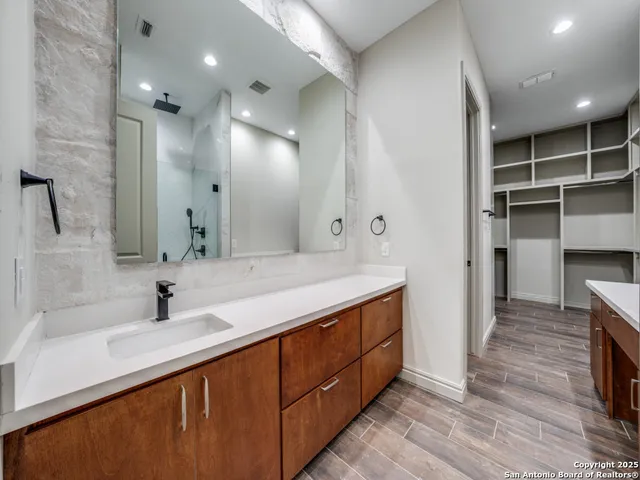 a view of a room with wooden floor and staircase