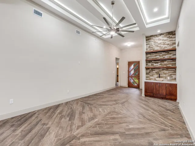 a view of an empty room with a window