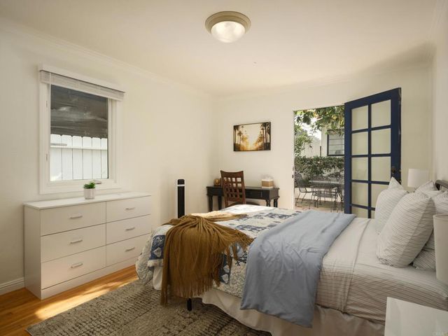 a bedroom with a bed and a window