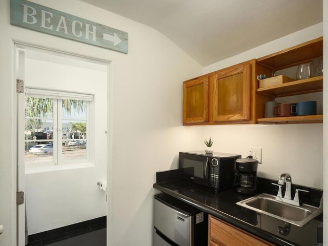 a view of a sink and a microwave