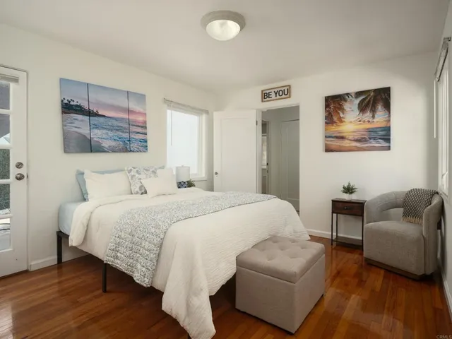 a bedroom with a bed and a couch