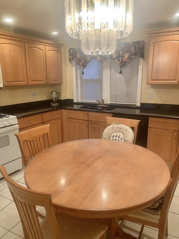 144-144A Salem Street Boston, MA 02113 - Photo 2 of 31 a large white kitchen with a large window