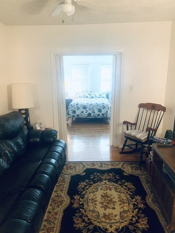 144-144A Salem Street Boston, MA 02113 - Photo 7 of 31 a living room with furniture and a window