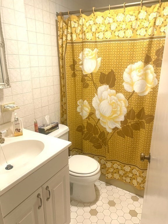 144-144A Salem Street Boston, MA 02113 - Photo 10 of 31 a bathroom with a sink toilet and shower