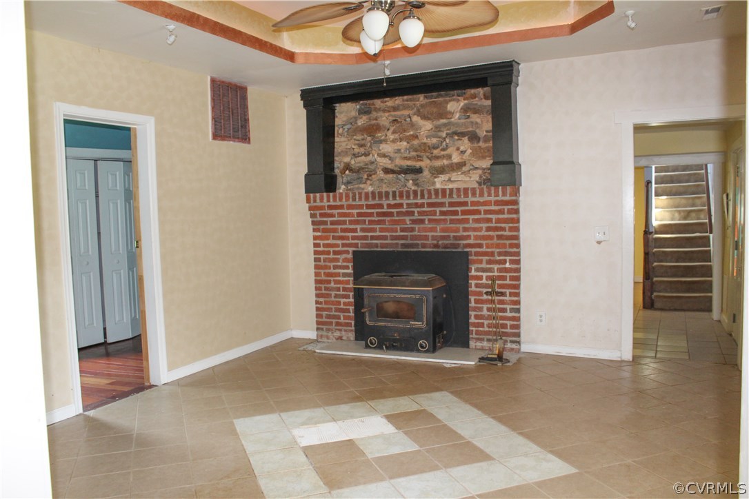 2729 Arritt Road Partlow, VA 22534 - Photo 16 of 30 a living room with a fireplace and a ceiling fan