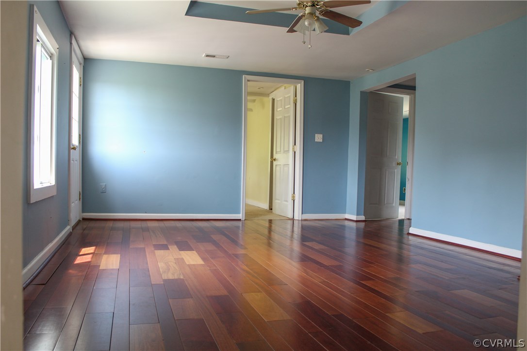 2729 Arritt Road Partlow, VA 22534 - Photo 23 of 30 an empty room with wooden floor and windows