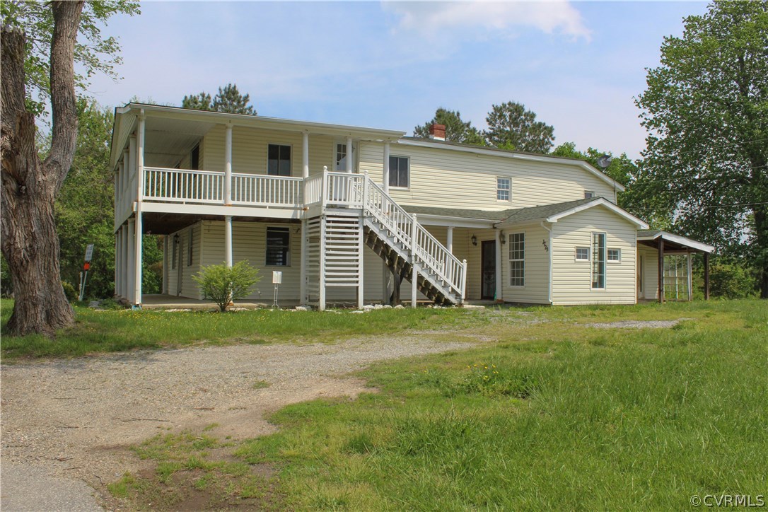 2729 Arritt Road Partlow, VA 22534 - Photo 4 of 30 a view of a yard in front of a house with large trees