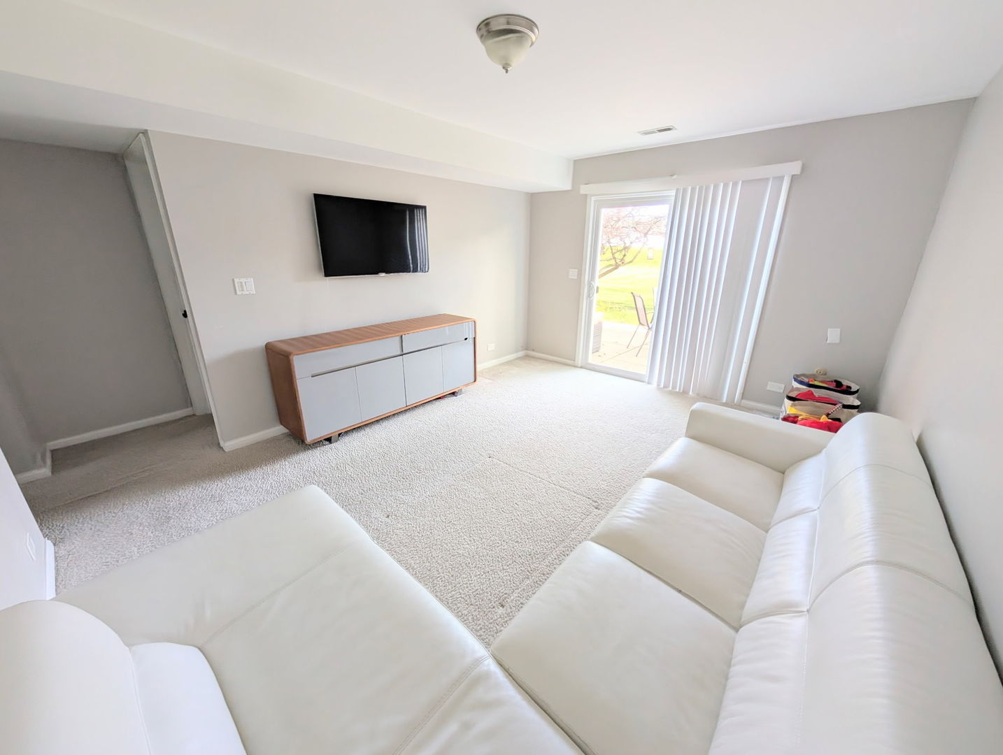 27W210 Providence Lane Winfield, IL 60190 - Photo 2 of 12 a living room with furniture and a flat screen tv