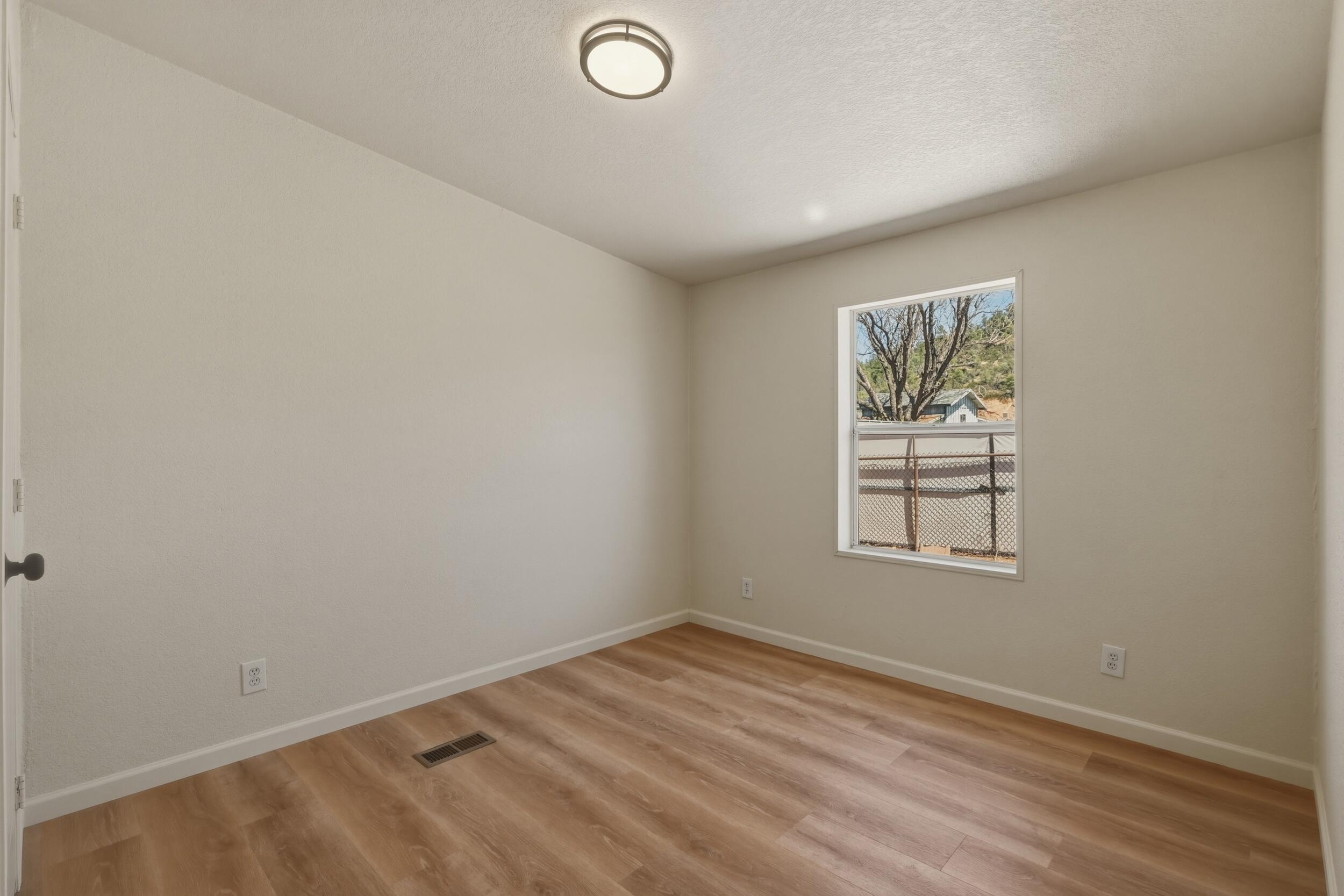 312 East Cedar Milll Road Star Valley, AZ 85541 - Photo 21 of 27 an empty room with a window
