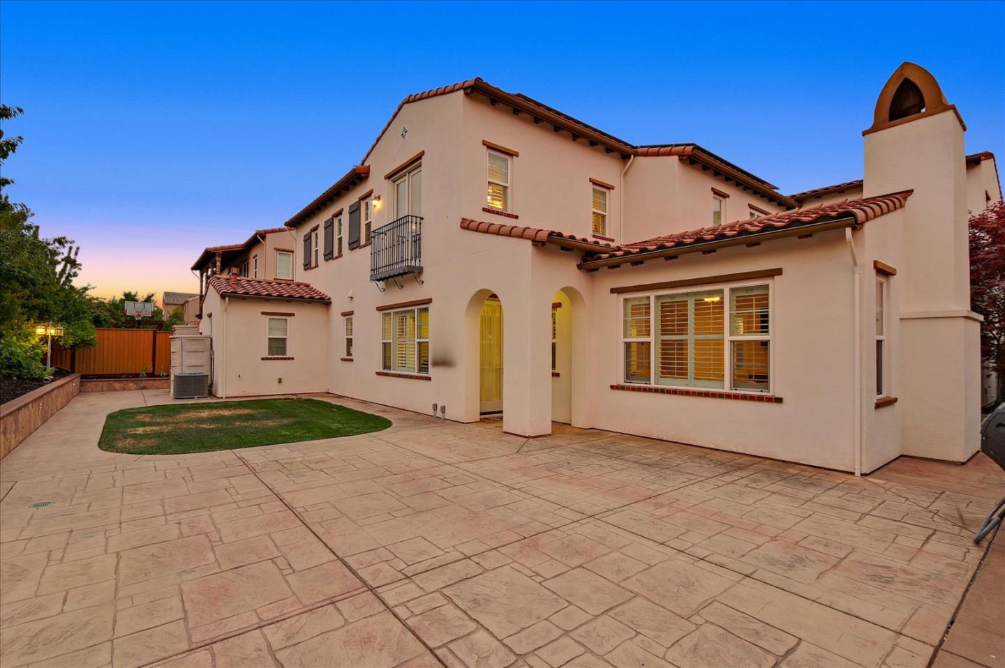 2333 Poppyview Avenue San Ramon, CA 94582 - Photo 50 of 65 a view of a white house with a yard and potted plants