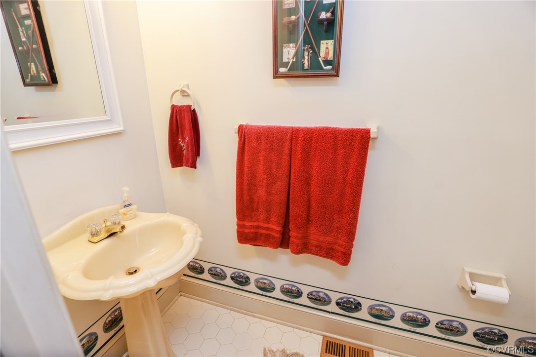 8606 Old Brompton Road Chesterfield, VA 23832 - Photo 15 of 36 a bathroom with a sink and a mirror