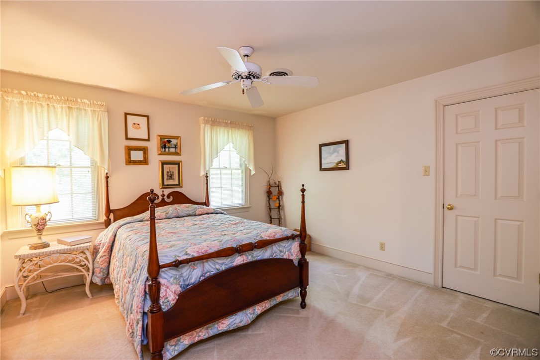 8606 Old Brompton Road Chesterfield, VA 23832 - Photo 16 of 36 a bedroom with a bed a table and chair