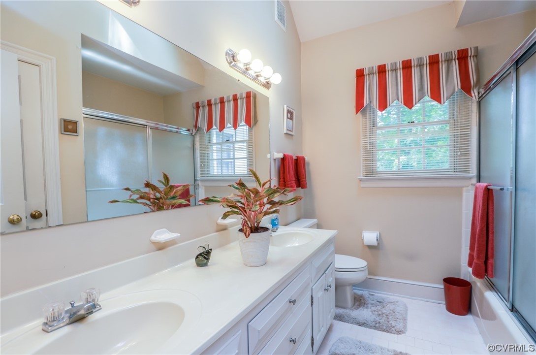 8606 Old Brompton Road Chesterfield, VA 23832 - Photo 17 of 36 a bathroom with a sink vanity mirror and toilet
