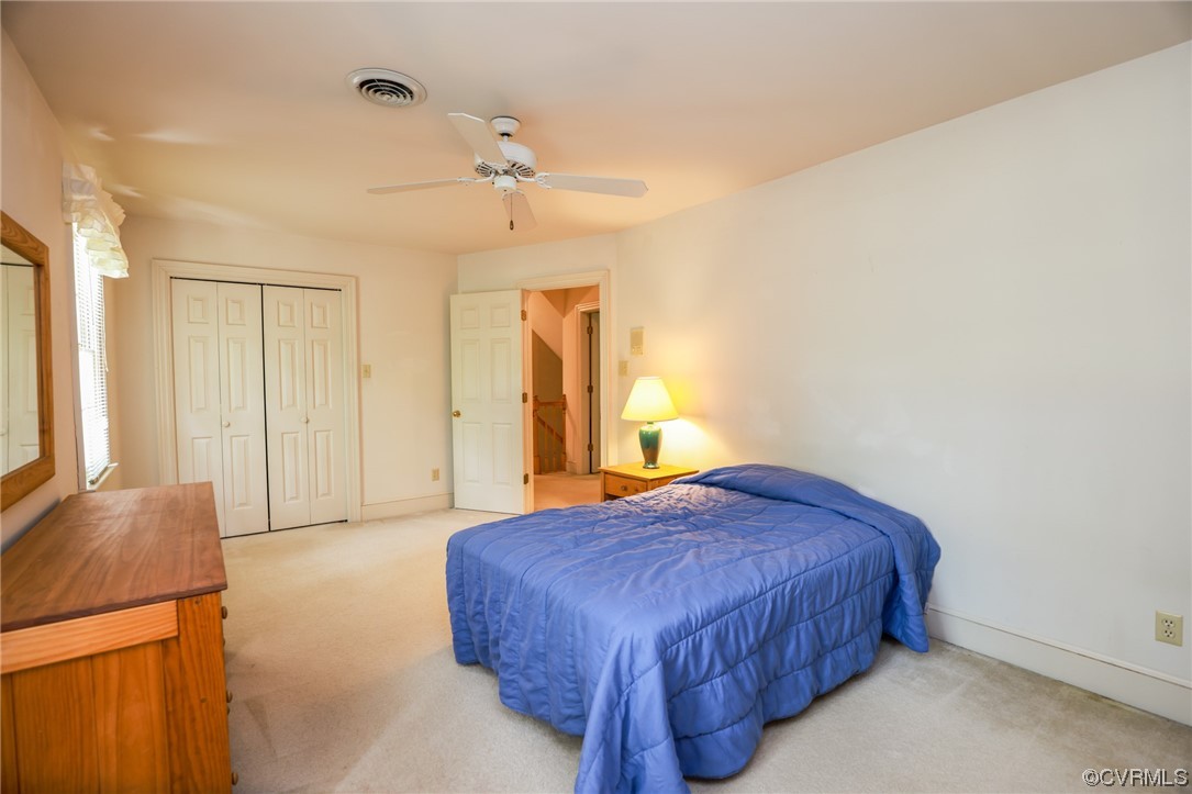 8606 Old Brompton Road Chesterfield, VA 23832 - Photo 21 of 36 a spacious bedroom with a bed and a dresser next to a window