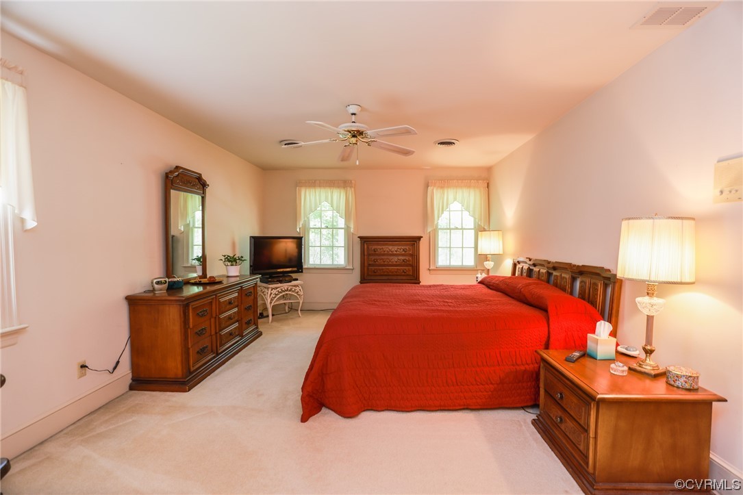 8606 Old Brompton Road Chesterfield, VA 23832 - Photo 24 of 36 a bed room with a bed and a lamp