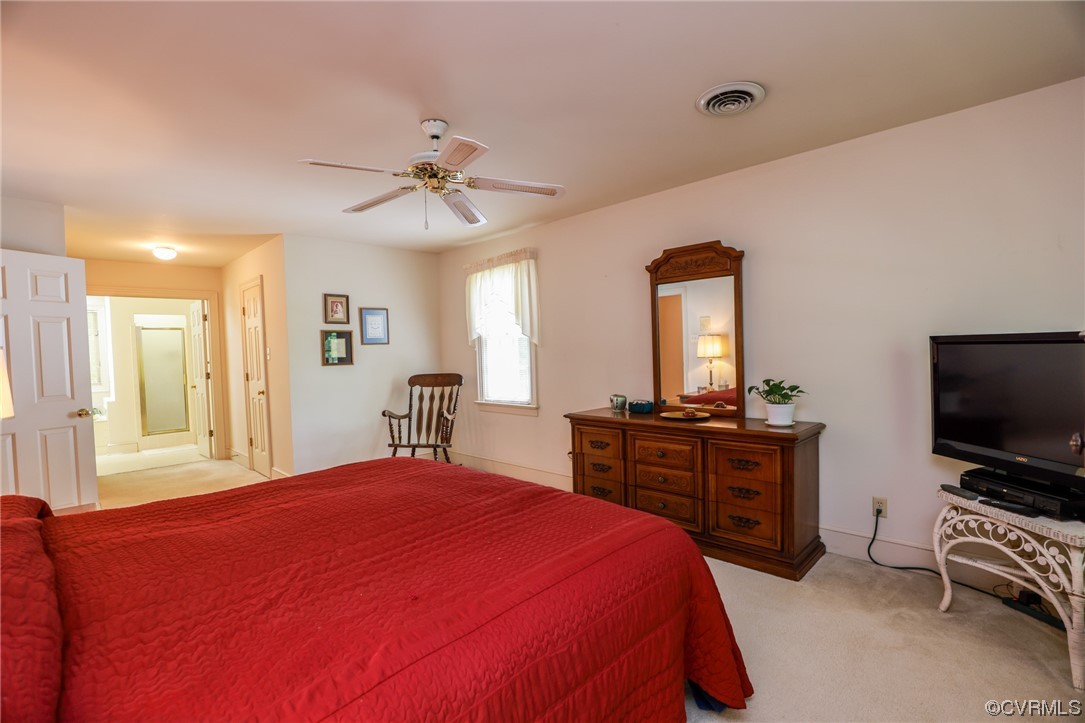 8606 Old Brompton Road Chesterfield, VA 23832 - Photo 25 of 36 a bedroom with a bed and a flat screen tv