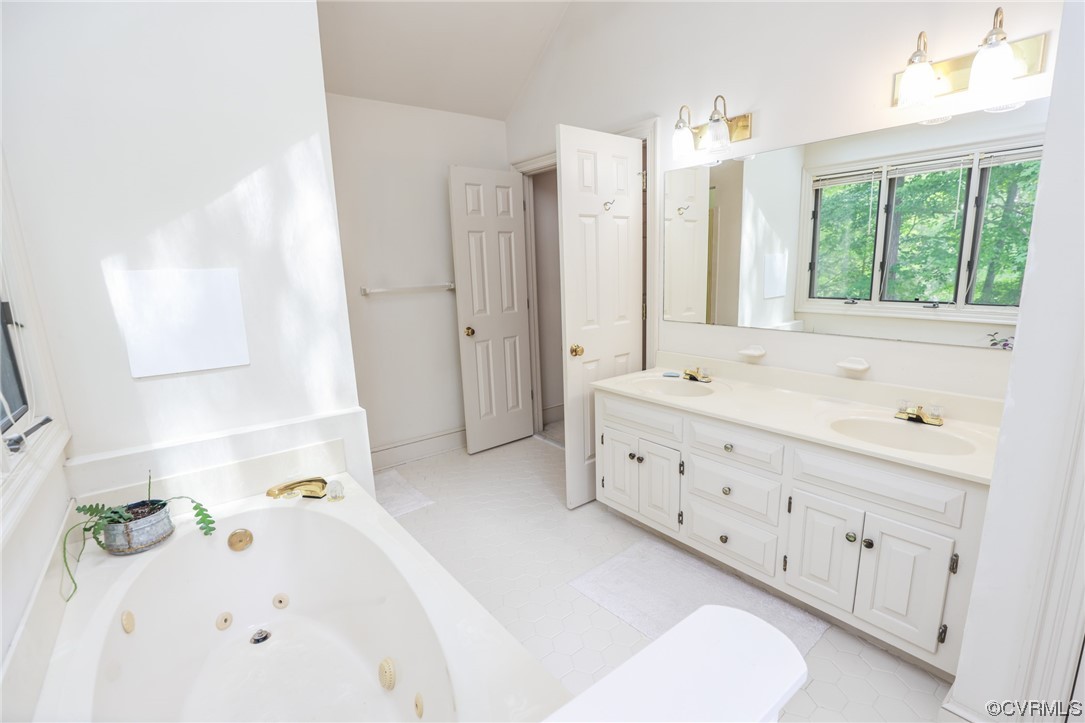 8606 Old Brompton Road Chesterfield, VA 23832 - Photo 28 of 36 a bathroom with a tub sink and mirror