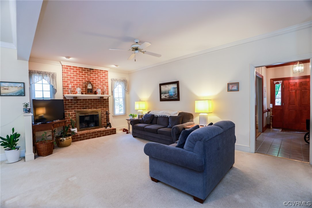 8606 Old Brompton Road Chesterfield, VA 23832 - Photo 6 of 36 a living room with furniture a flat screen tv and a fireplace