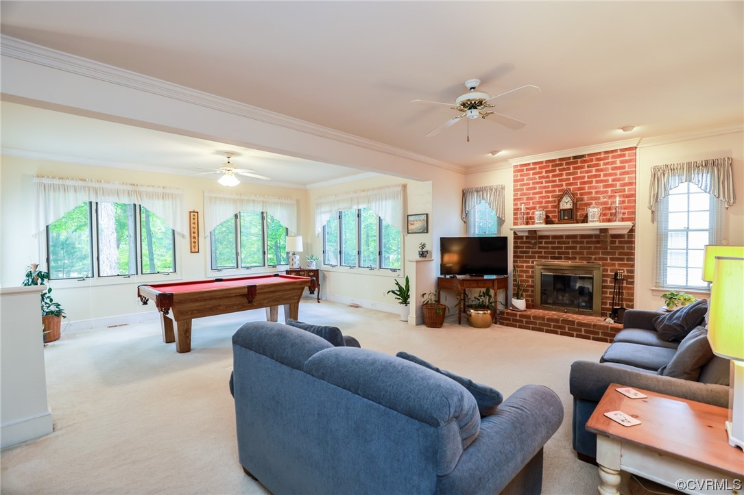 8606 Old Brompton Road Chesterfield, VA 23832 - Photo 7 of 36 a living room with furniture a fireplace and a flat screen tv