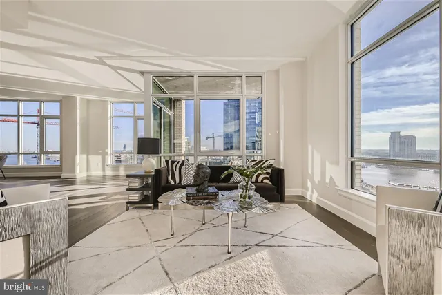 a view of two chairs and table in a kitchen