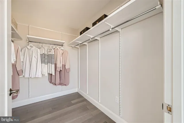 a living room with furniture and next to a window