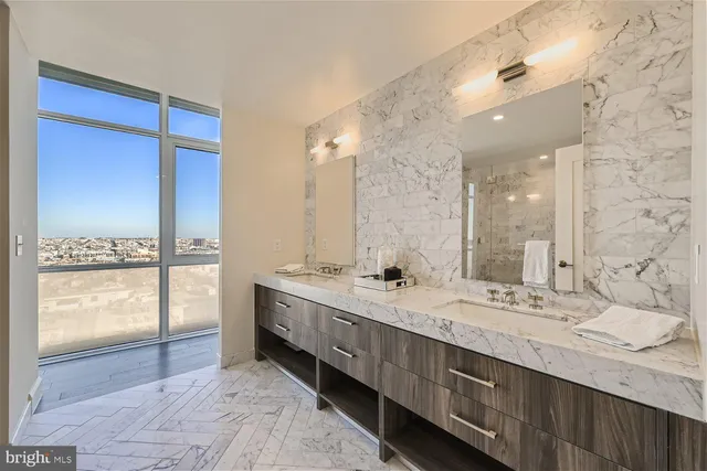 a bathroom with a glass shower door
